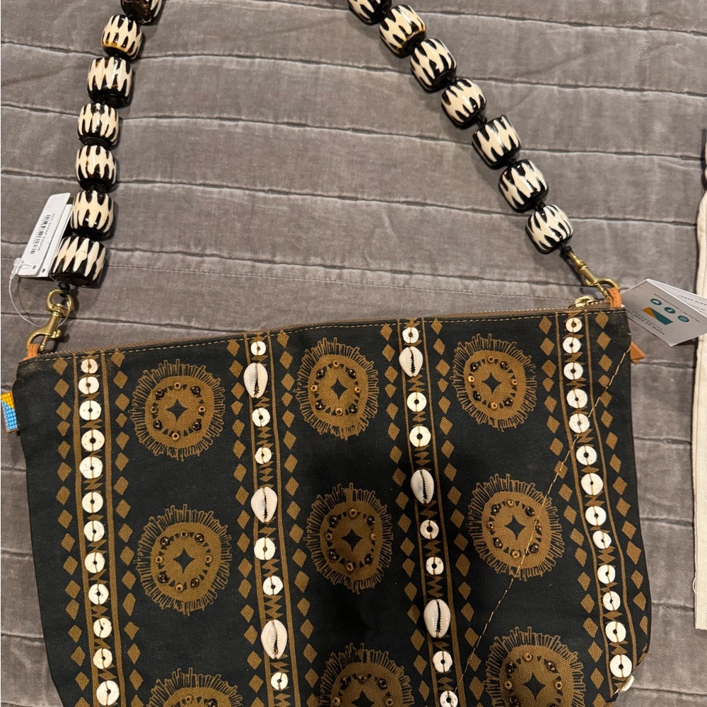 ubuntu life jumbo convertible pouch chocolate with bone bead strap.